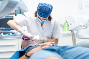Dental clinic, doctor performing an endodontic operation on a patient